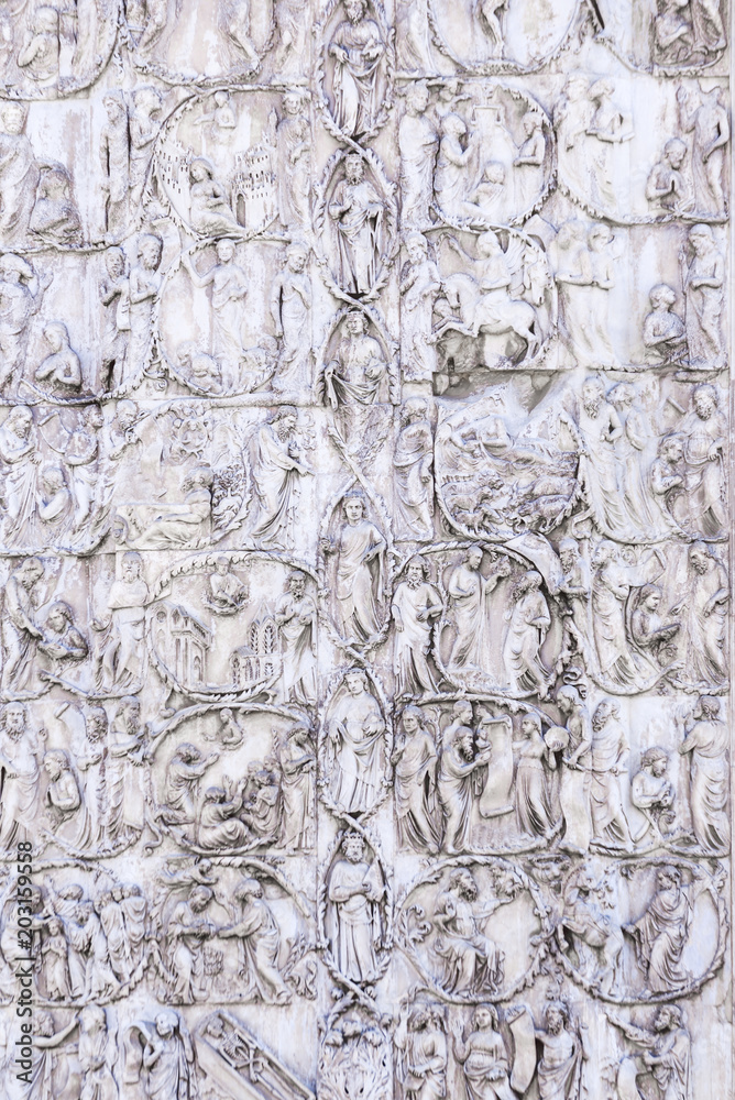 Detail of the facade of the Duomo of Orvieto, Italy. Marble bas-relief representing episodes of the bible