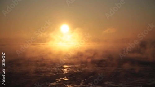 Evaporation over the sea at sunrise.