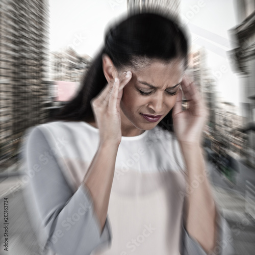 Businesswoman having an headache against new york street