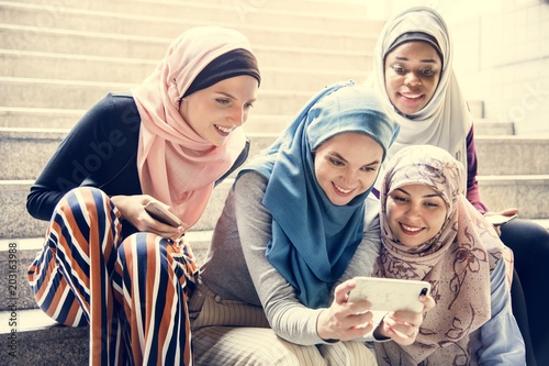 Photography Group of islamic women looking at smartphone