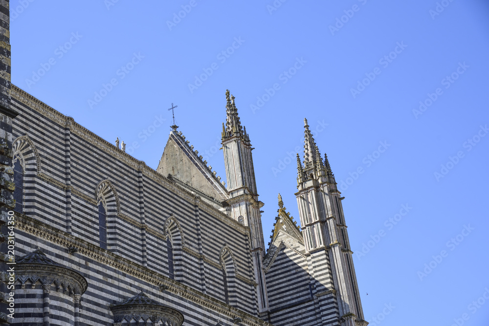 Back side of the cathedral of Orvieto, Italy. one can observe the particular decoration in two-colored marble stripes