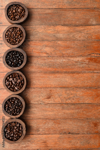 Close up of coffee beans in wooden bowl