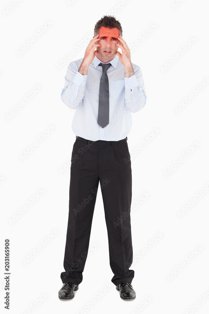 Sad businessman with his hands on his temples against a white background Sad businessman with his hands on his temples against a white background