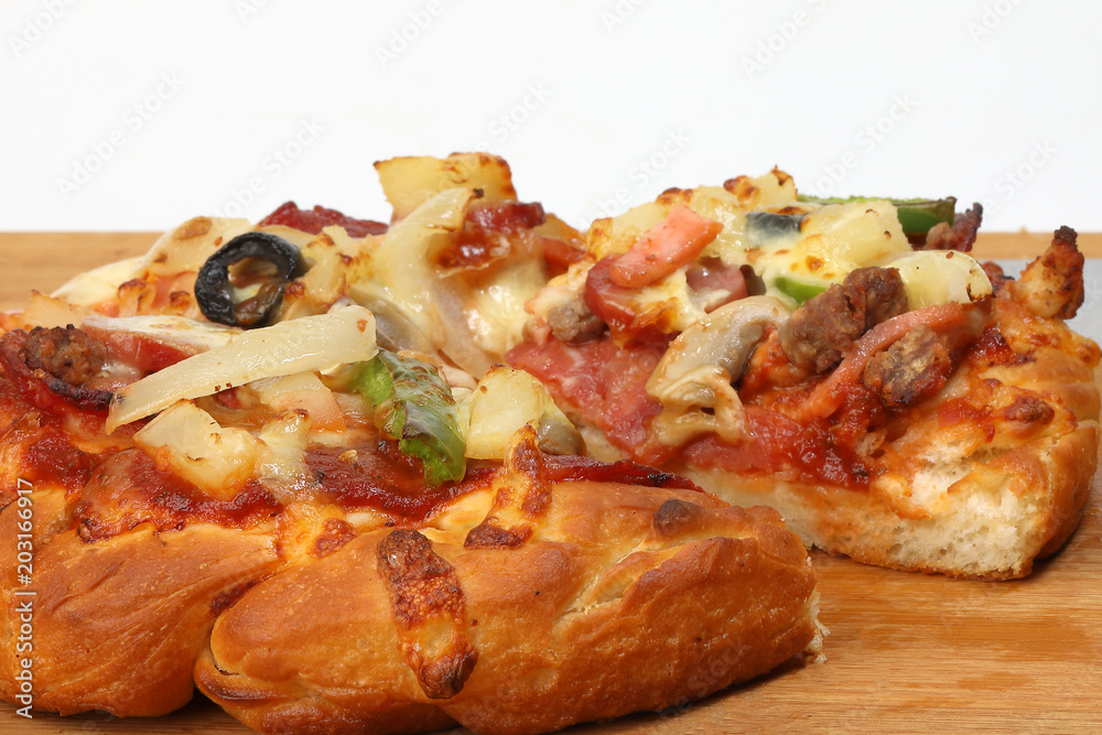 Pizza beef chicken peperoni cheese chilli capsicum onion olive on wooden board Pizza beef chicken peperoni cheese chilli capsicum onion olive on wooden board