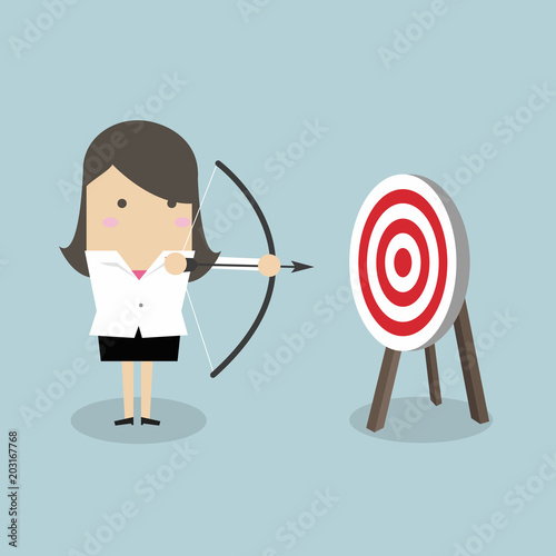 Businesswoman with archery bow and target.