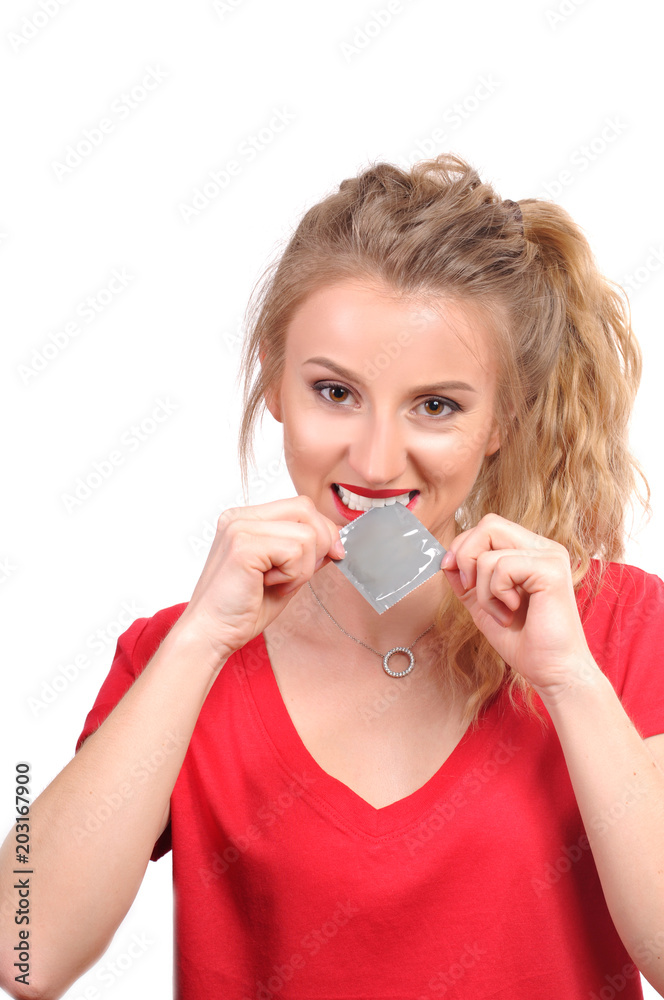 Beautiful girl is holding a condom Beautiful girl is holding a condom