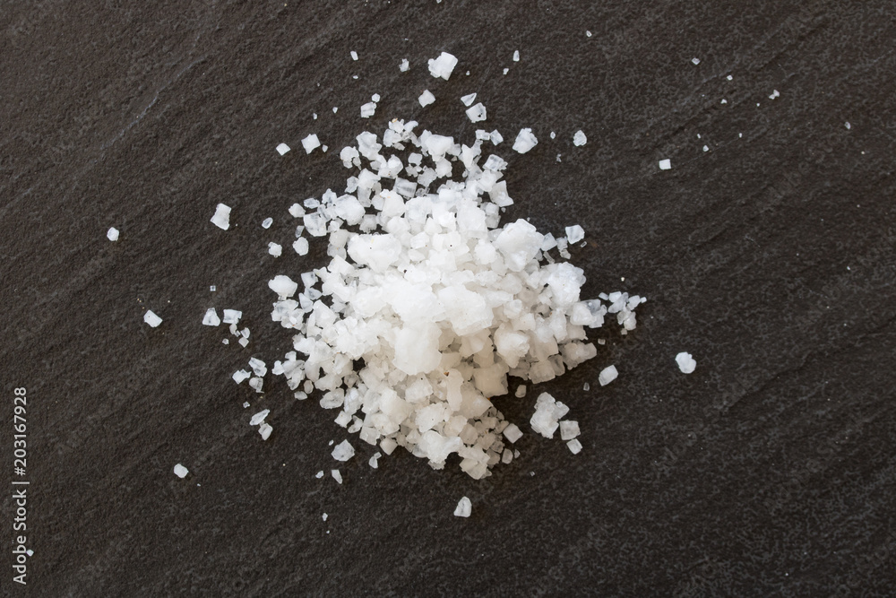 Close up white salt on a black background