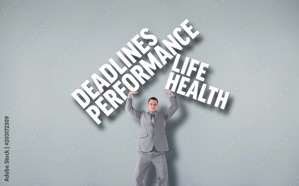 Portrait of a businessman pushing against grey vignette Portrait of a businessman pushing against grey vignette