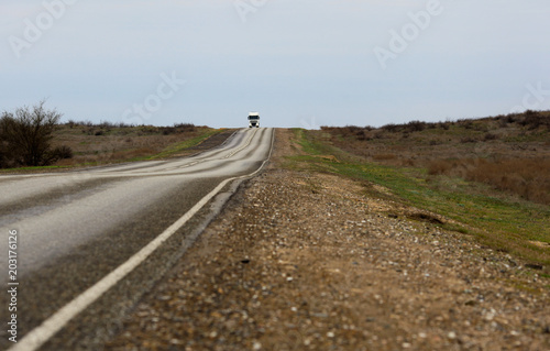 An empty asphalt road in the steppe at sunset. The Astrakhan region. Russia.