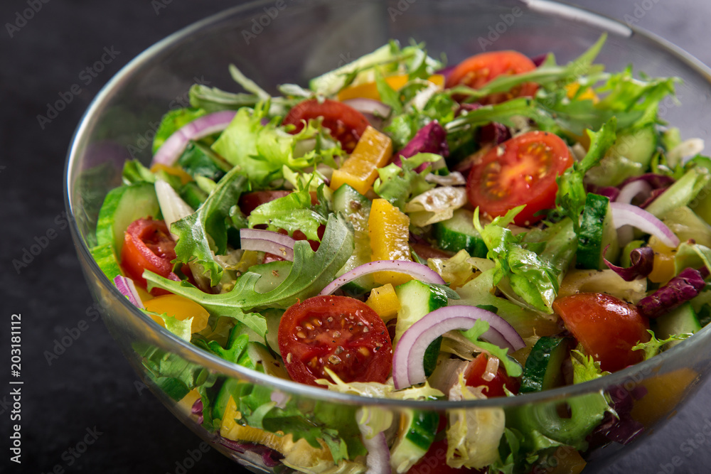 tomatoes, bell pepper, cucumber, lettuce and red onion salad