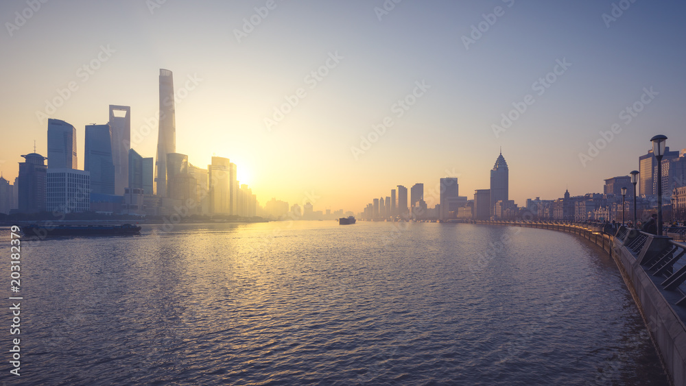 Shanghai Lujiazui business district and Huangpu river from the bund during sunrise , copy space .