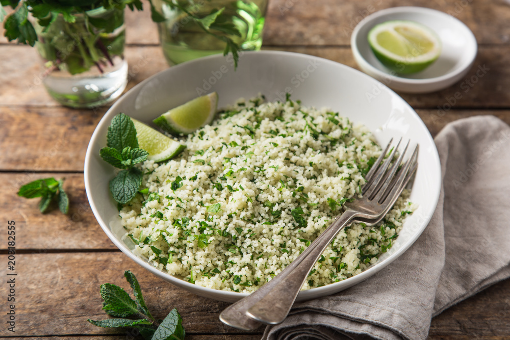 couscous with lemon and herbs in white bowl couscous with lemon and herbs in white bowl