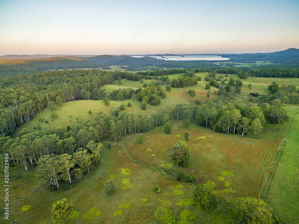Aerial view of rural area and Myall Lake at sunset. Topi Topi, New South Wales, Australia