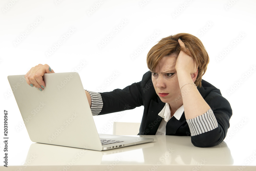 Attractive young business woman working on her computer stressed, unhappy and overwhelmed. Attractive young business woman working on her computer stressed, unhappy and overwhelmed.