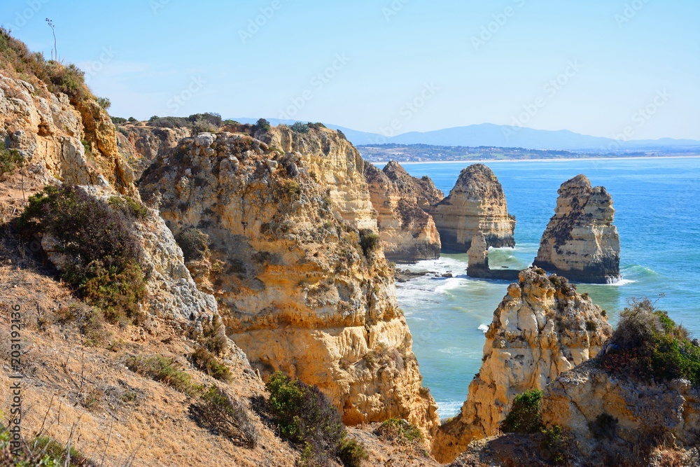 Elevated view of the rugged coastline and cliffs at Ponta da Piedade, Lagos, Portugal.