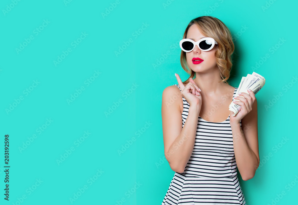 portrait of a young girl in sunglasses with money on green background portrait of a young girl in sunglasses with money on green background