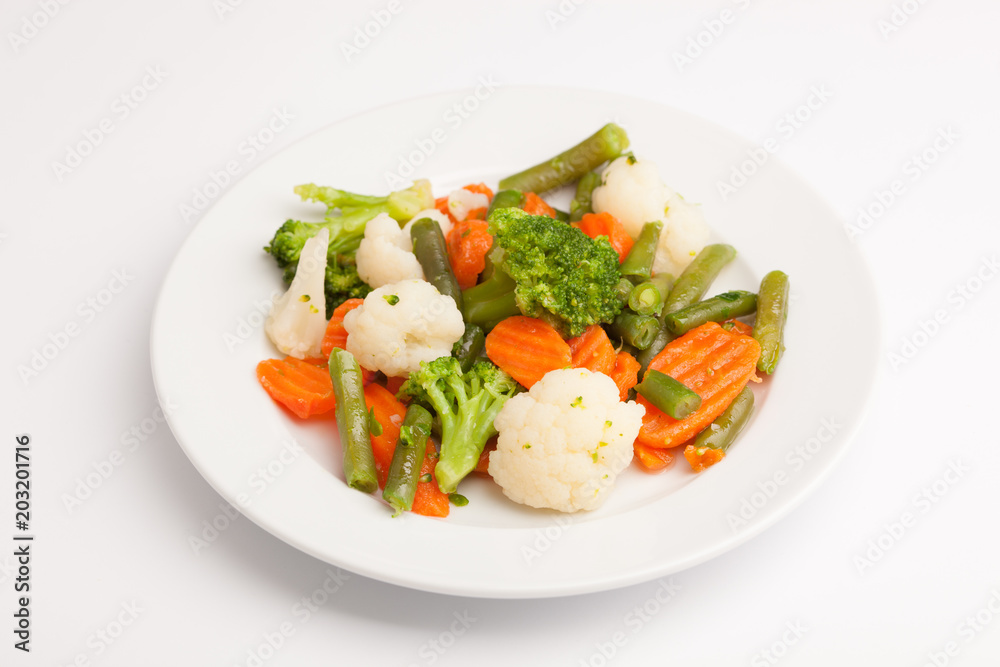 beautiful photo close-up menu of fresh vegetable salad in a plate on a white background beautiful photo close-up menu of fresh vegetable salad in a plate on a white background