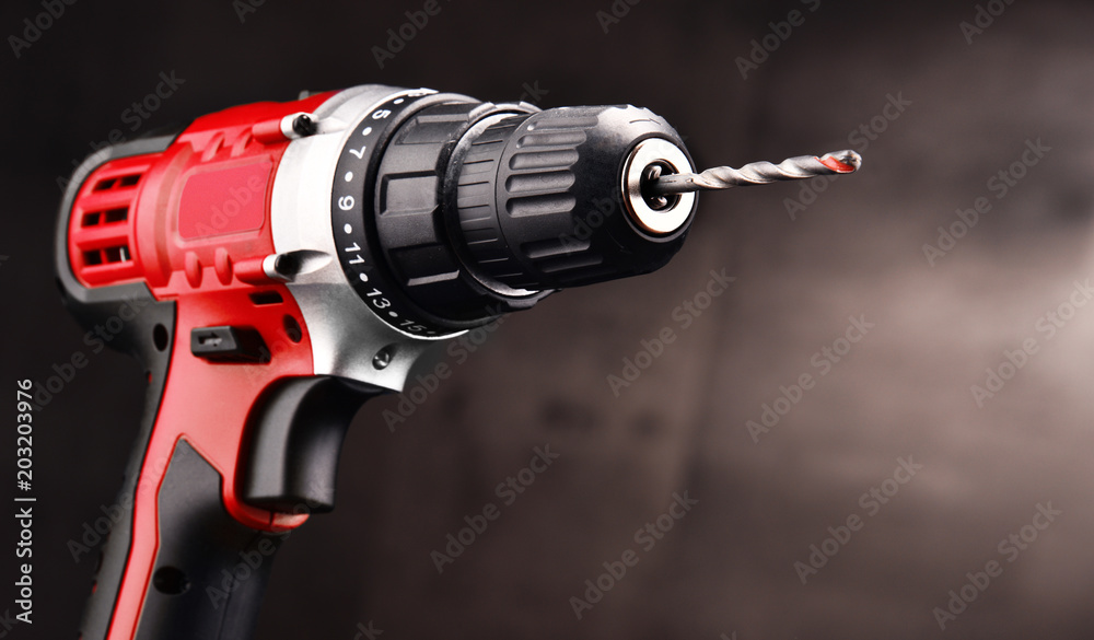 Cordless drill with drill bit working also as screw gun - obrazy, fototapety, plakaty 