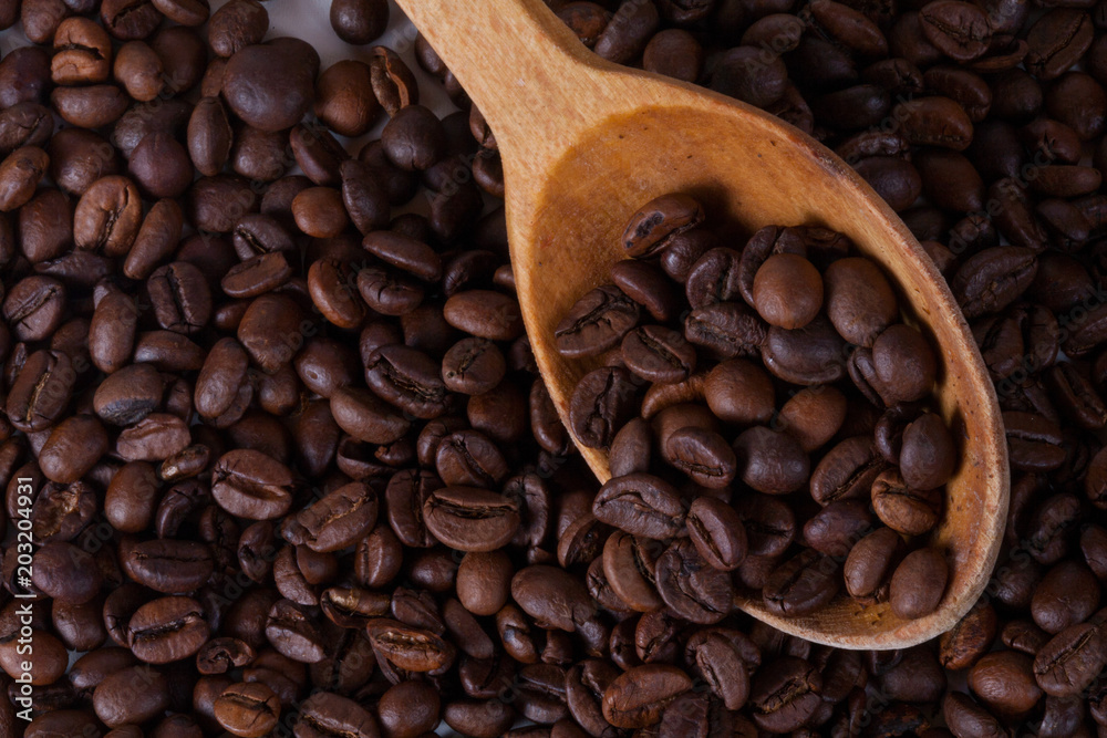 Fototapeta premium Grain of coffee, beans and spoon. White background