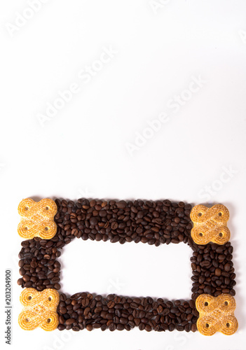 Photo frame made from coffee beans and cookies. There is a place for your text