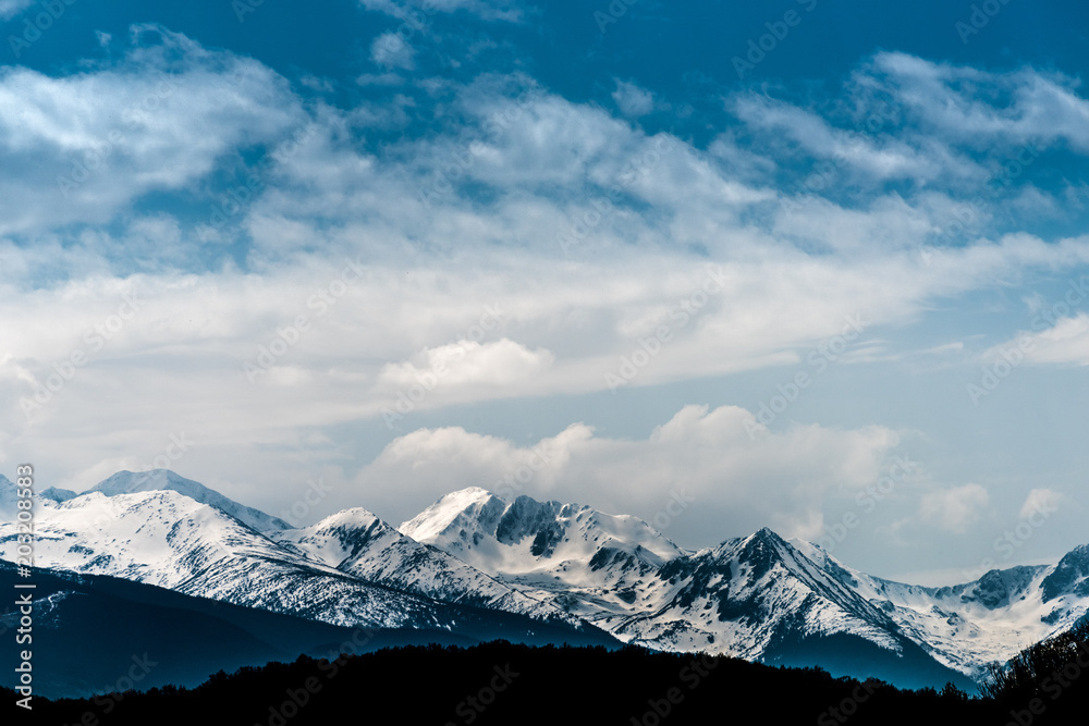 Carpathian mountains peak covered in snow with blue skies