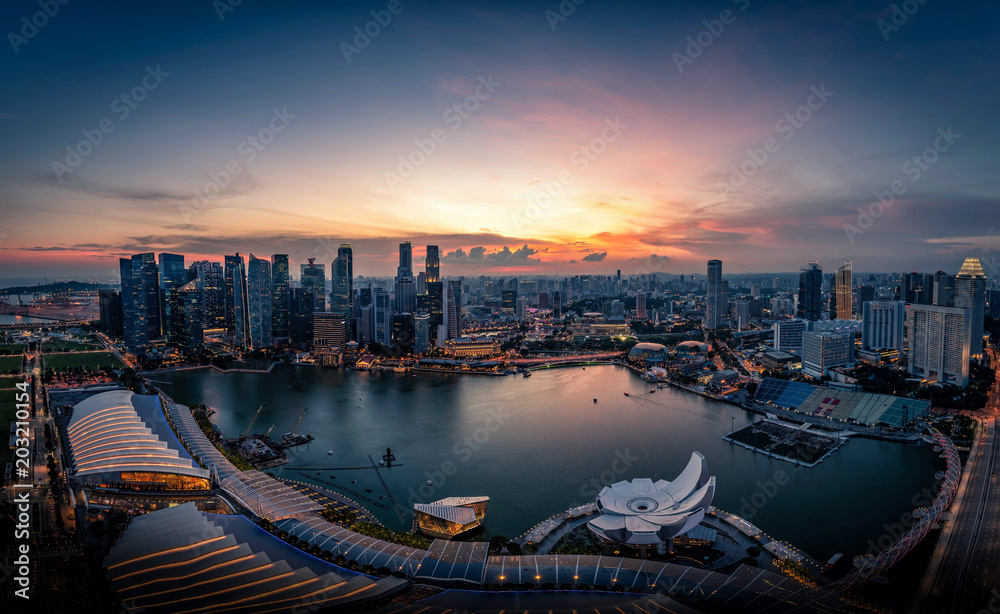 Singapore Skyline and view of skyscrapers on Marina Bay at sunset.
