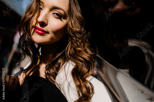 Beautiful young women with red lips in the white dress © shunevich