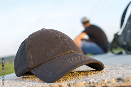 travel cap and backpack photographs