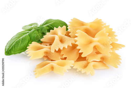 Farfalle pasta and basil isolated on white background. Raw.
