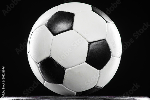 Classic soccer ball against black background