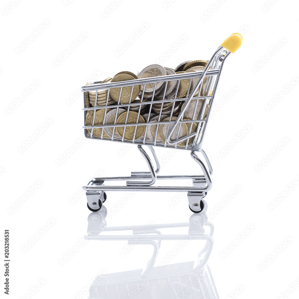 Shopping cart filled with currency Shopping cart filled with currency