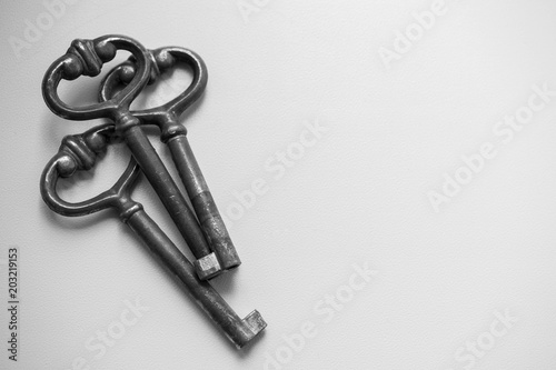 three old vintage key on white background. Antique rusty keys on white background