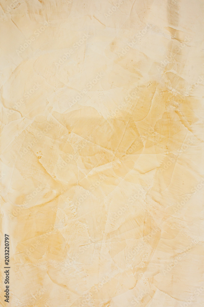 Wall of decorative yellow plaster background