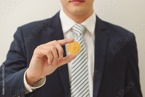 Close up of ethereum in man hands isolated on white background.