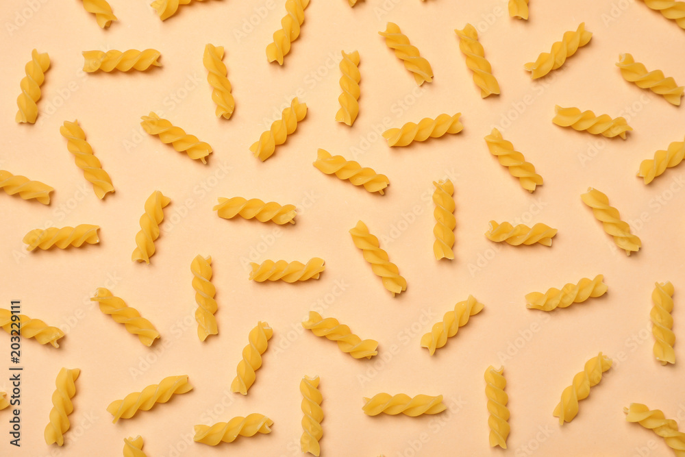 Flat lay composition with raw pasta on color background Flat lay composition with raw pasta on color background