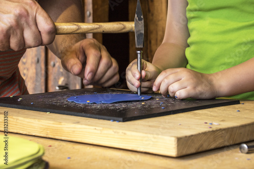 Young Boy and adult Man working together