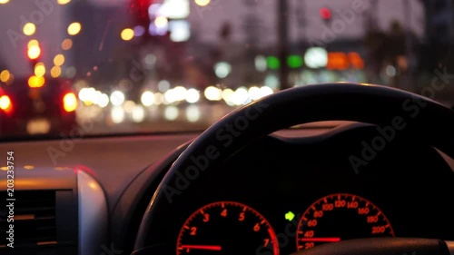 car driving in night city with traffic jam