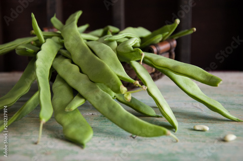 Fresh green pods of flat beans