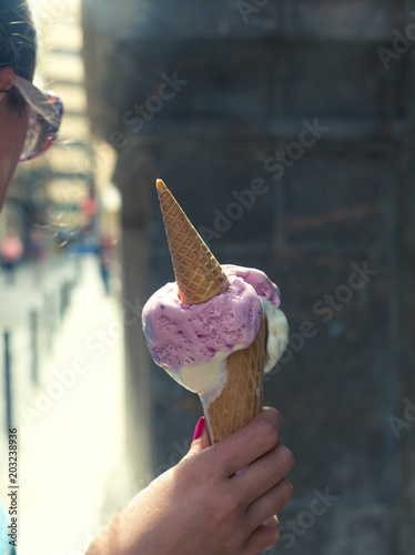 Stylish hipster woman holding an ice cream in her hand. Summer © zakiroff