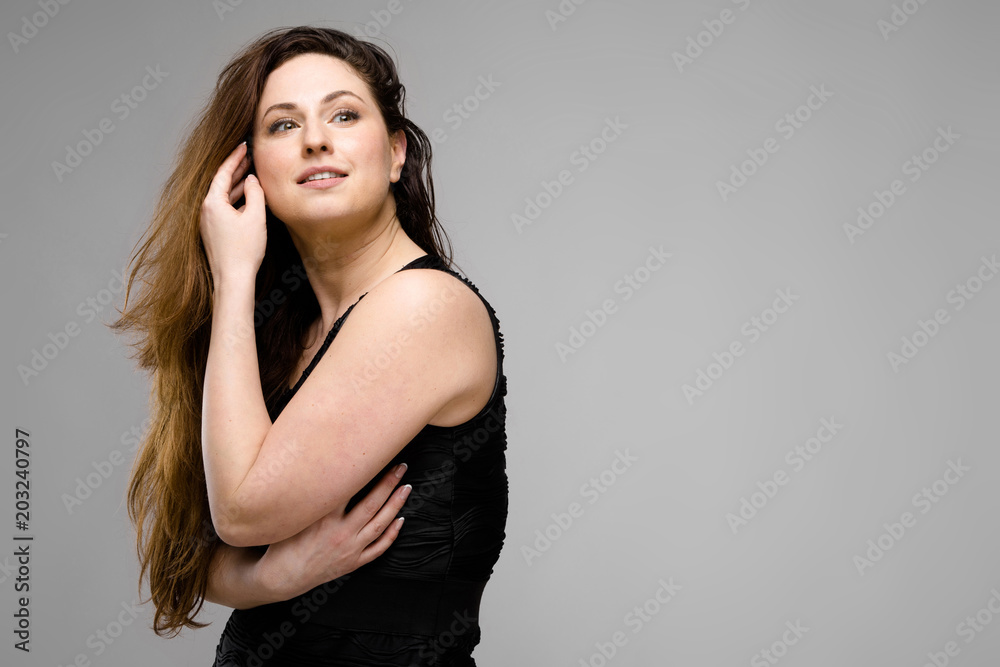 Fototapeta premium Attractive overweight woman in fashionable clothes