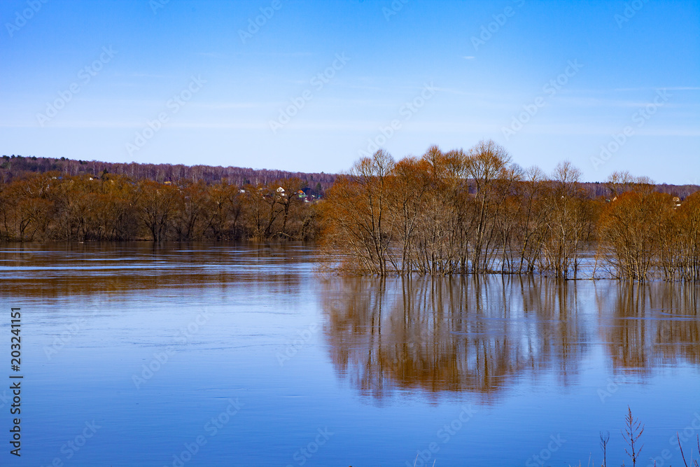 Beautiful spring landscape with a spilled river Beautiful spring landscape with a spilled river