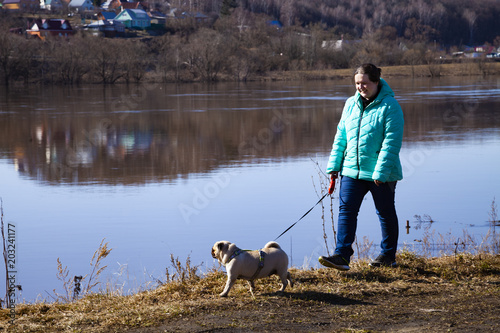 Woman is walking with a dog