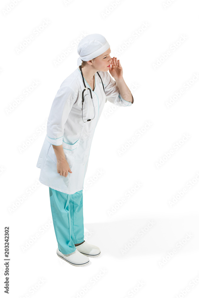 Beautiful young woman in white coat posing and shouting at studio. Full length studio shot isolated on white. Beautiful young woman in white coat posing and shouting at studio. Full length studio shot isolated on white.