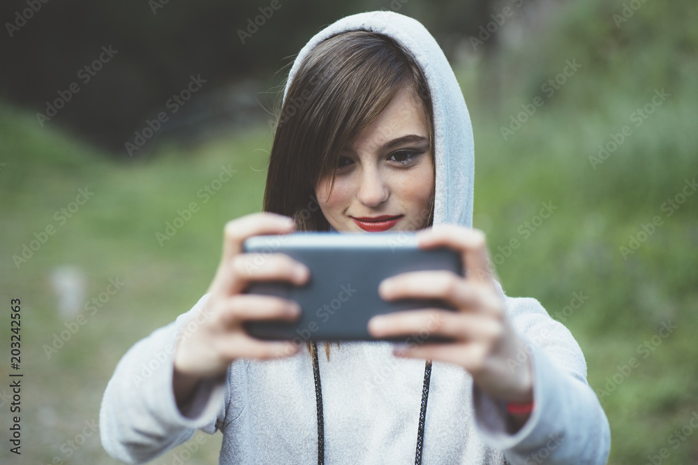 Portrait of teenage girl with sports clothes and smartphone Portrait of teenage girl with sports clothes and smartphone