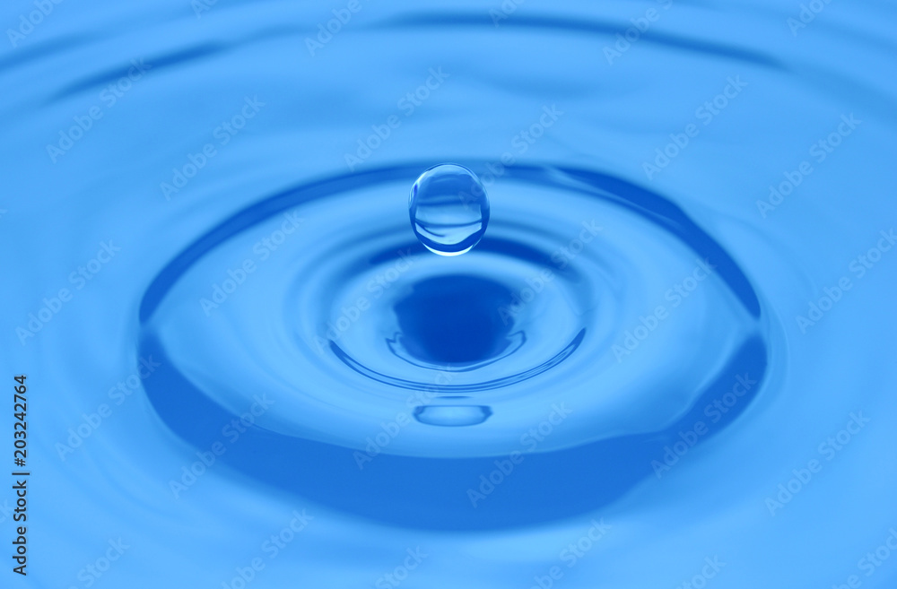 Water drop on a blue surface. Water drop on a blue surface.