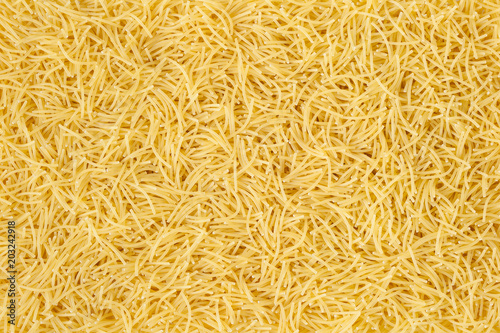 Uncooked vermicelli pasta background photo