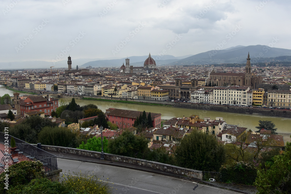 View from Piazzale Michelangelo, Florence, Italy down to the historic town of Florence and Arno River in a rainy day