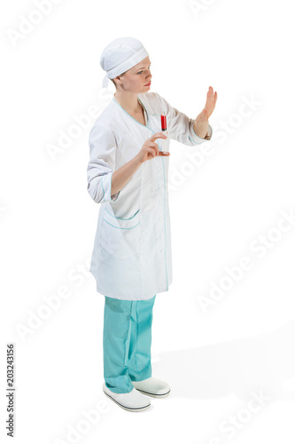 beautiful young woman doctor in medical robe holding syringe in hand.