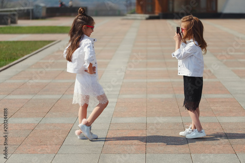 stylish funny little girls on the street