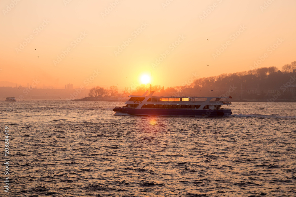Tourist and public boat at sunset. The Sea of Marmara. Istanbul, Turkey